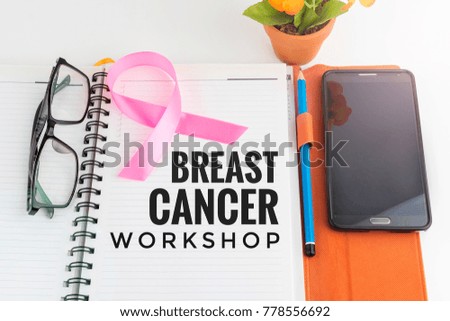 Concept media social health care breast cancer on note book and smartphone with word BREAST CANCER WORKSHOP