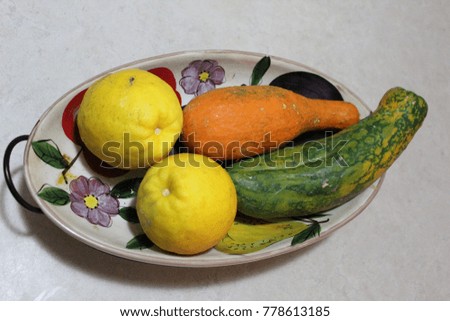  squash and lemons in a display