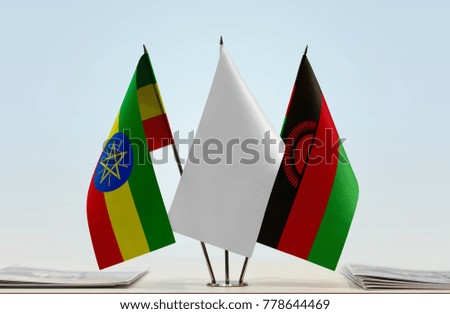 Flags of Ethiopia and Malawi with a white flag in the middle