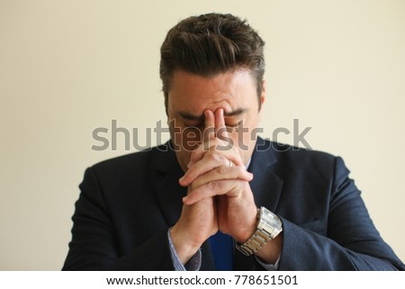 Tired businessman focusing on his thoughts