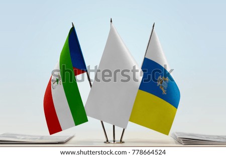 Flags of Equatorial Guinea and Canary Islands with a white flag in the middle