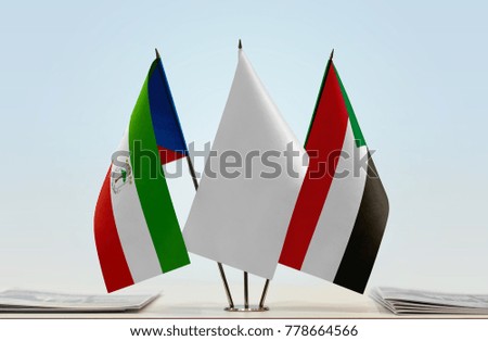 Flags of Equatorial Guinea and Sudan with a white flag in the middle