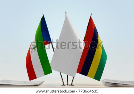 Flags of Equatorial Guinea and Mauritius with a white flag in the middle
