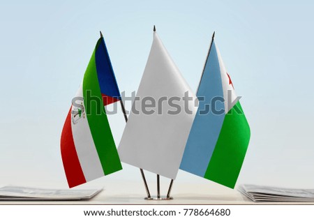 Flags of Equatorial Guinea and Djibouti with a white flag in the middle