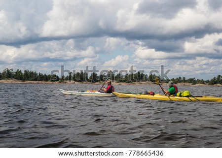 A group of sea kayakers on Georgian Bay, in Ontario, Canada. 