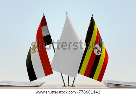 Flags of Egypt and Uganda with a white flag in the middle