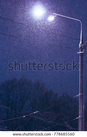 Winter street lamp at night