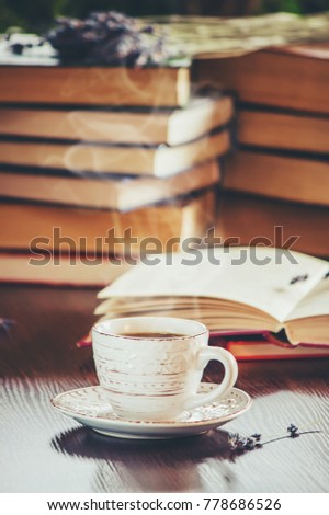 A cup of coffee and a book. Leisure. Selective focus.
