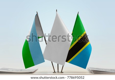 Flags of Djibouti and Tanzania with a white flag in the middle