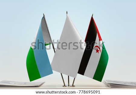 Flags of Djibouti and Sahrawi Arab Democratic Republic with a white flag in the middle