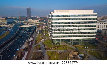 Office buildings against the background of a skyscraper Royalty-Free Stock Photo #778699774