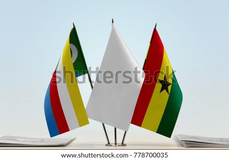 Flags of Comoros and Ghana with a white flag in the middle