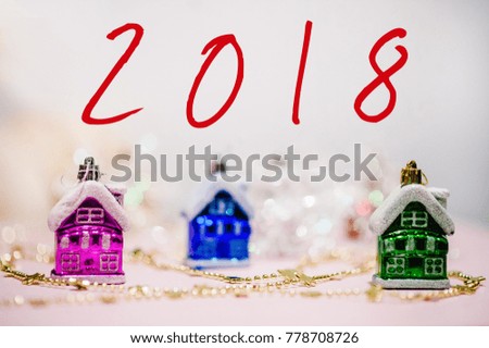 Festive background, text 2018. Celebration Concept. Merry Christmas, Happy New Year written with different decoration background with festive ornaments on white space for design. Greeting card.