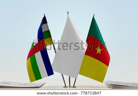 Flags of Central African Republic and Cameroon with a white flag in the middle