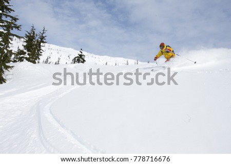 A young man skiing in the mountains near Terrace, British Columbia, Canada.