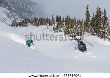 Helicopter skiing in the mountains near Terrace, British Columbia.  Royalty-Free Stock Photo #778719091