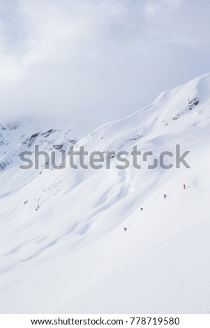 A group of young men skiing in the mountains near Terrace, British Columbia, Canada.