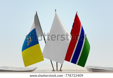 Flags of Canary Islands and The Gambia with a white flag in the middle