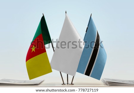 Flags of Cameroon and Botswana with a white flag in the middle