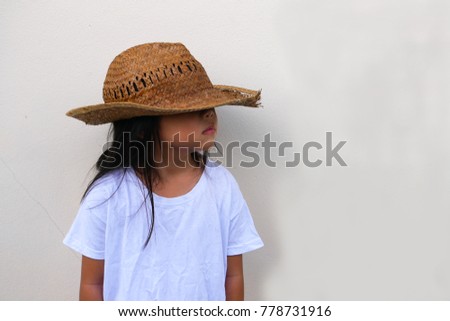 The girl wears a hat.
