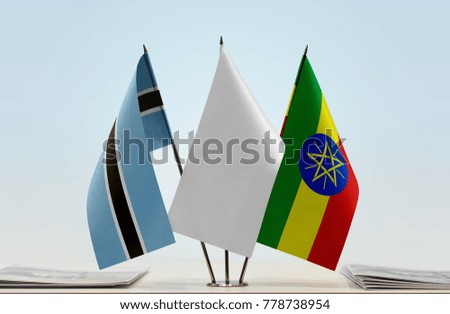 Flags of Botswana and Ethiopia with a white flag in the middle