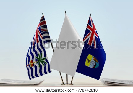 Flags of British Indian Ocean Territory and Saint Helena with a white flag in the middle