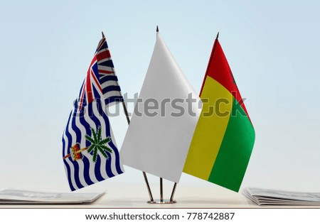 Flags of British Indian Ocean Territory and Guinea-Bissau with a white flag in the middle