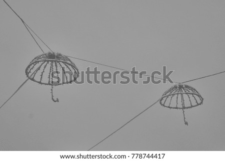 Lanterns in the form of umbrellas in the city park.