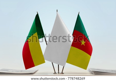 Flags of Benin and Cameroon with a white flag in the middle
