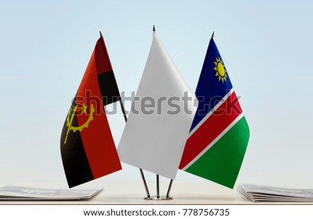 Flags of Angola and Namibia with a white flag in the middle