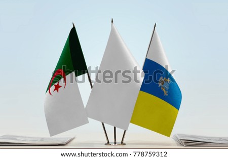 Flags of Algeria and Canary Islands with a white flag in the middle