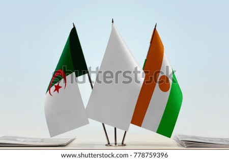 Flags of Algeria and Niger with a white flag in the middle
