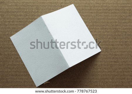 Blank portrait mock-up paper. brochure magazine isolated on brown background, changeable background / white paper template isolated 