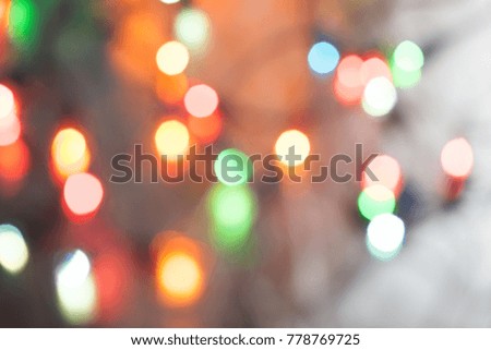Abstract blurred background. Colorful shimmering Christmas lights bokeh of electric garlands. New Year bokeh background.