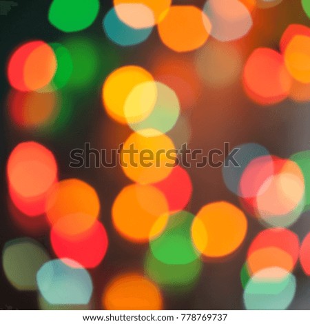 Abstract blurred background. Colorful shimmering Christmas lights bokeh of electric garlands. New Year bokeh background.