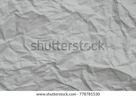 Texture crease of white paper for template wallpaper. wrinkle of gray paper crumpled background.