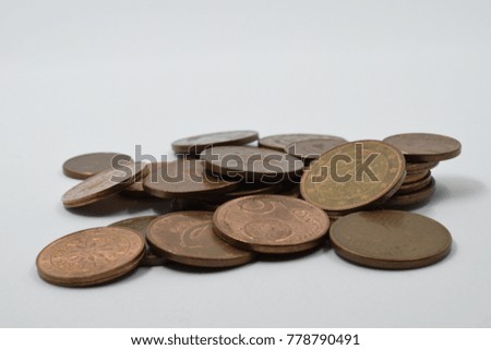 Pile of coins isolated on a white background. Euro cent coins piled on top of each other.