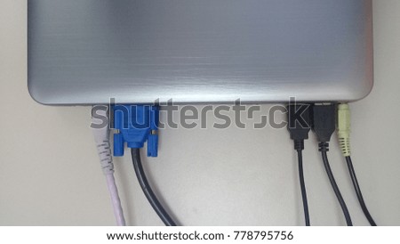 Close up of many usb cable plugged to computer laptop. Royalty-Free Stock Photo #778795756