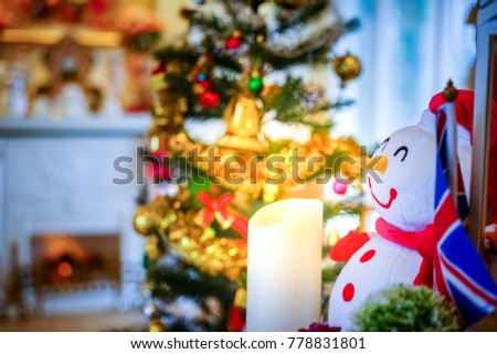 Snowman in Christmas holiday and candle of happiness