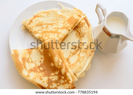 Gorgeous breakfast hot pancakes  and milk. Rustic style.White background. Top view. Flat lay.