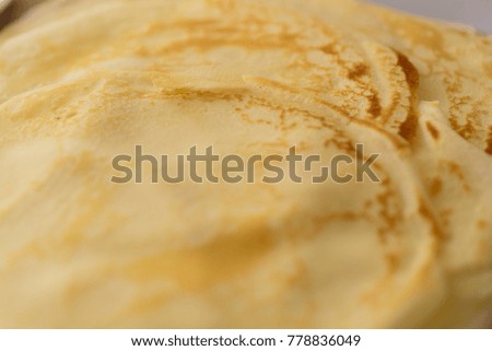 Stack of pancakes on a wooden background. Top view. Flat lay.