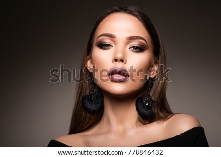 Beautiful woman with professional make up and hairstyle