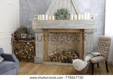 the interior of living room with fireplace chair and grey wall