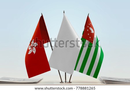 Flags of Hong Kong and Abkhazia with a white flag in the middle