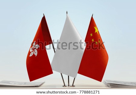 Flags of Hong Kong and China with a white flag in the middle