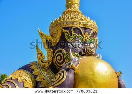  A statue of celestial monster which causes elipses by eating the sun or moon (Rahu) in temple ,Wat Phra Loi ,Suphanburi ,  THAILAND.