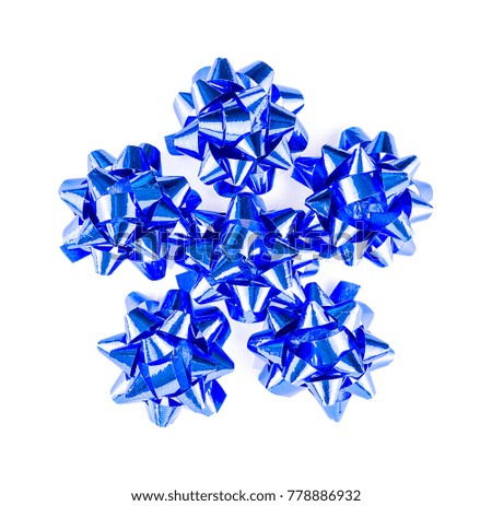 Top view of blue shiny gift bows on white