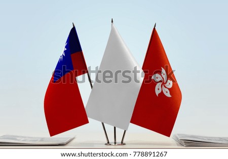 Flags of Taiwan and Hong Kong with a white flag in the middle