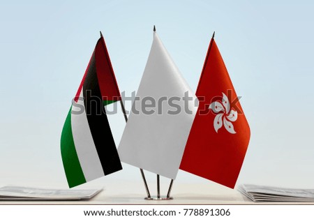 Flags of Palestine and Hong Kong with a white flag in the middle