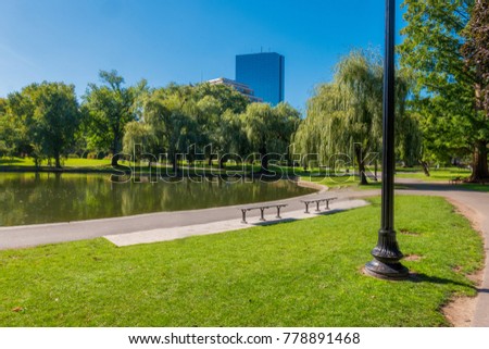Boston USA Public Garden, Common Frog Pond and city skyline. 